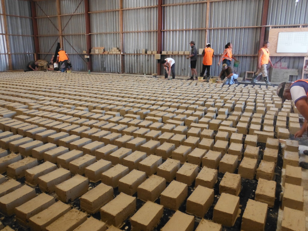 Forming adobe bricks by hand