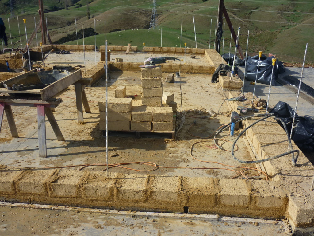 A light adobe house at the beginning of construction. Very simple building system for load-bearing walls.